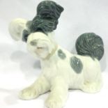 Lladro seated dog, L: 16 cm. No cracks chips or visible restoration. P&P Group 2 (£18+VAT for the