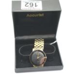 Boxed Accurist Quartz analogue gold plated wristwatch with black face, original sticker to back,