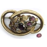 Victorian pinchbeck amethyst set brooch, missing one stone. P&P Group 1 (£14+VAT for the first lot