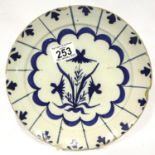 Early tin glazed blue and white floral patterned shallow bowl, D: 22 cm with chips to rim. P&P Group