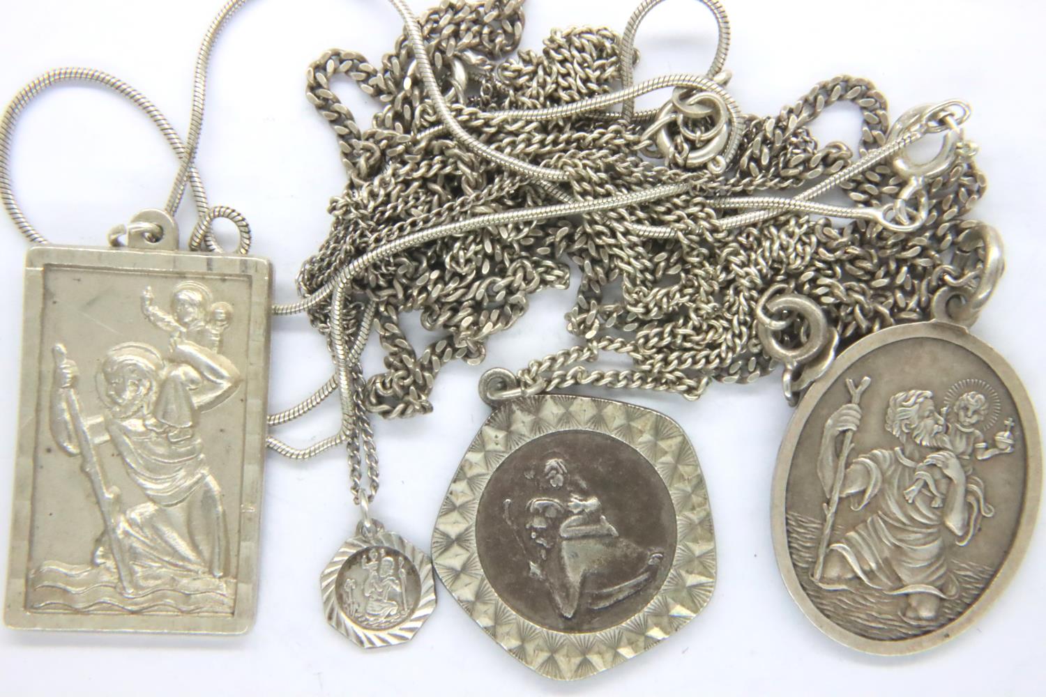 Four 925 silver St Christopher pendant necklaces, combined 28g. P&P Group 1 (£14+VAT for the first