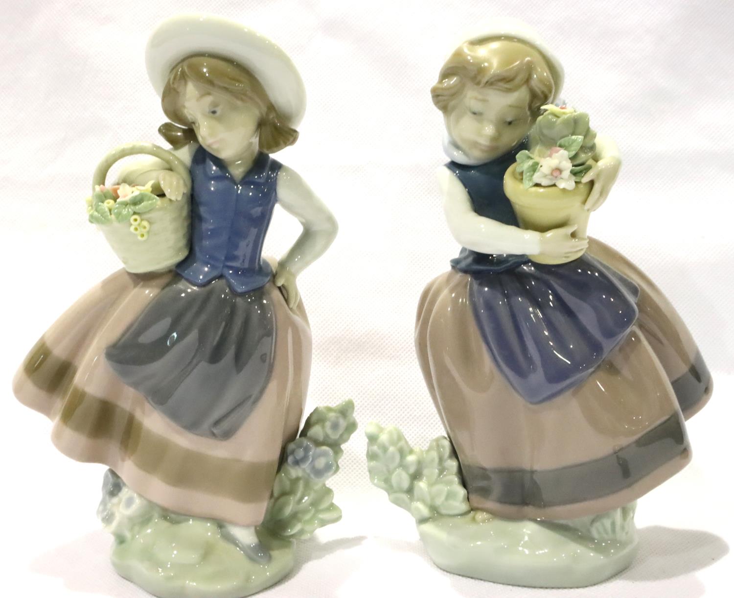 Two Lladro girls with flower baskets, largest H: 17 cm, one with small loss of petal. P&P Group