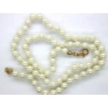 Boxed synthetic pearl necklace with yellow metal clasp, L: 51 cm. P&P Group 1 (£14+VAT for the first