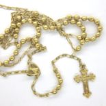 Yellow metal rosary beads, chain L: 84 cm, 10g. P&P Group 1 (£14+VAT for the first lot and £1+VAT