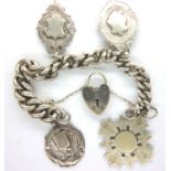 Hallmarked silver bracelet with four fobs and padlock clasp, L: 16 cm, combined 62g. P&P Group 1 (£