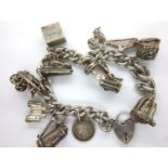 Sterling silver charm bracelet with eleven charms and safety chain, L: 16 cm, 68g. P&P Group 1 (£
