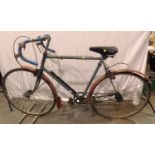 Three speed, 24 inch frame road bike with vintage bullhorn handles, pedals, mudguards and attached