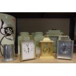 Selection of modern carriage clocks, three ceramic storage jars and a large ceramic vase. Not