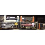 Five boxed diecast model cars including Burago and Maisto examples. Not available for in-house P&