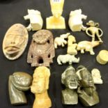 Carved stone African figurines and assorted masks. Not available for in-house P&P, contact Paul O'