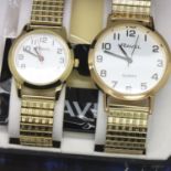 Ravel; ladies and gents matching wristwatches with black and white face, on stainless steel strap,