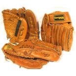 Three leather American baseball mitts with a Rawlings Official League baseball. P&P Group 2 (£18+VAT