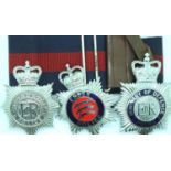 Three helmet plates; Merseyside Police, Essex Police and MOD Police with belt. P&P Group 2 (£18+