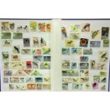 Stamp album with used world stamps including Zambia, Cuba, USA etc. P&P Group 1 (£14+VAT for the