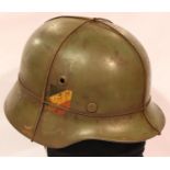 WWII German M40 helmet, original shell made by the rare maker FW Quist, GMBH, Esslingen. The liner