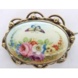 Crown Staffordshire pinchbeck framed hand painted brooch, L: 50 mm, minor discolouration verso. P&