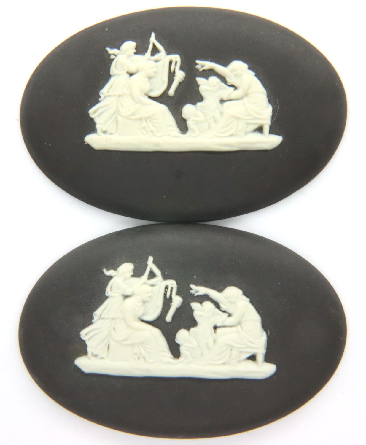 Pair of Wedgwood black and white jasperware plaques, each L: 45 mm. P&P Group 1 (£14+VAT for the