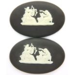 Pair of Wedgwood black and white jasperware plaques, each L: 45 mm. P&P Group 1 (£14+VAT for the