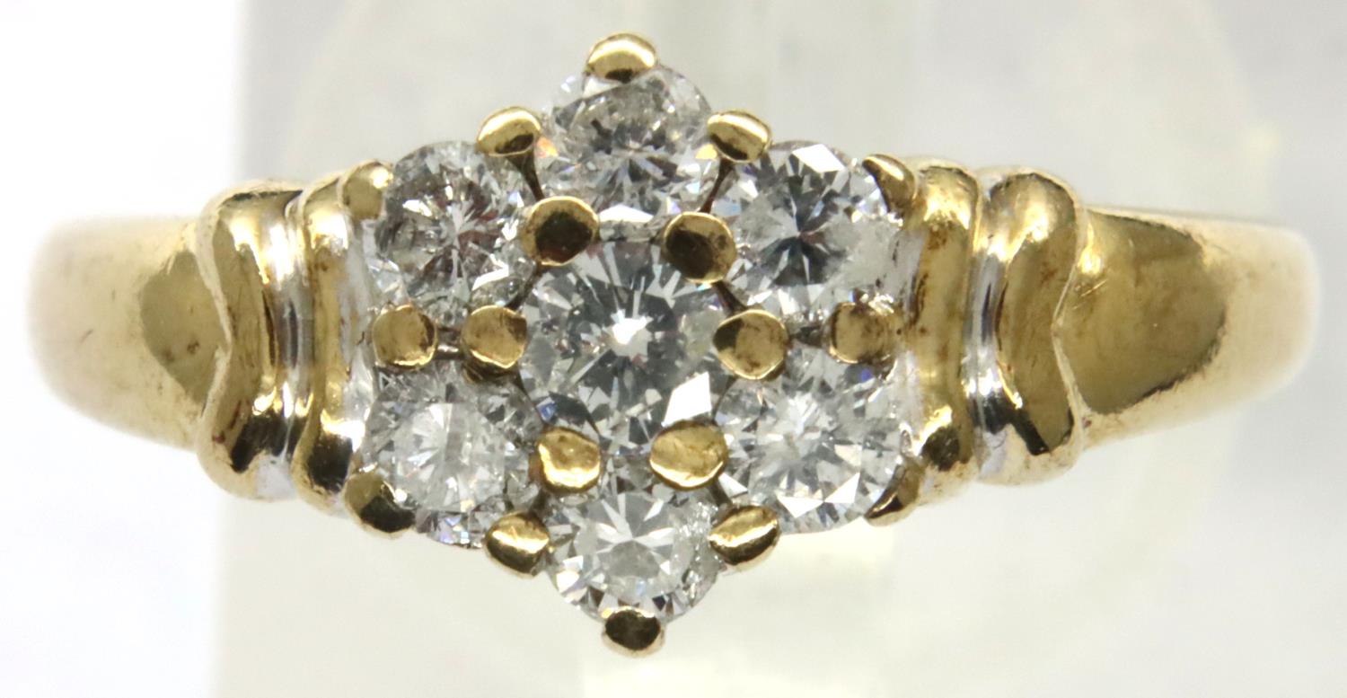 9ct gold and 0.5cts diamond daisy ring, size M/N, 2.7g. P&P Group 1 (£14+VAT for the first lot