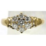 9ct gold and 0.5cts diamond daisy ring, size M/N, 2.7g. P&P Group 1 (£14+VAT for the first lot