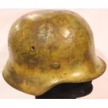 WWII Afrika Korps M42 helmet, the rim stamped with the letter Q, for the maker FW Quist, GMBH