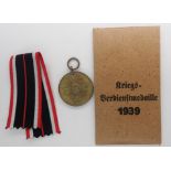 Third Reich War Merit Medal in original packet of issue. P&P Group 1 (£14+VAT for the first lot