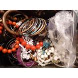 Lidded box containing unsorted costume jewellery mainly bangles. P&P Group 2 (£18+VAT for the