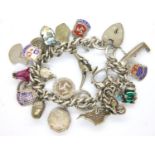 925 silver charm bracelet with 21 charms, L: 16 cm, 62g. P&P Group 1 (£14+VAT for the first lot