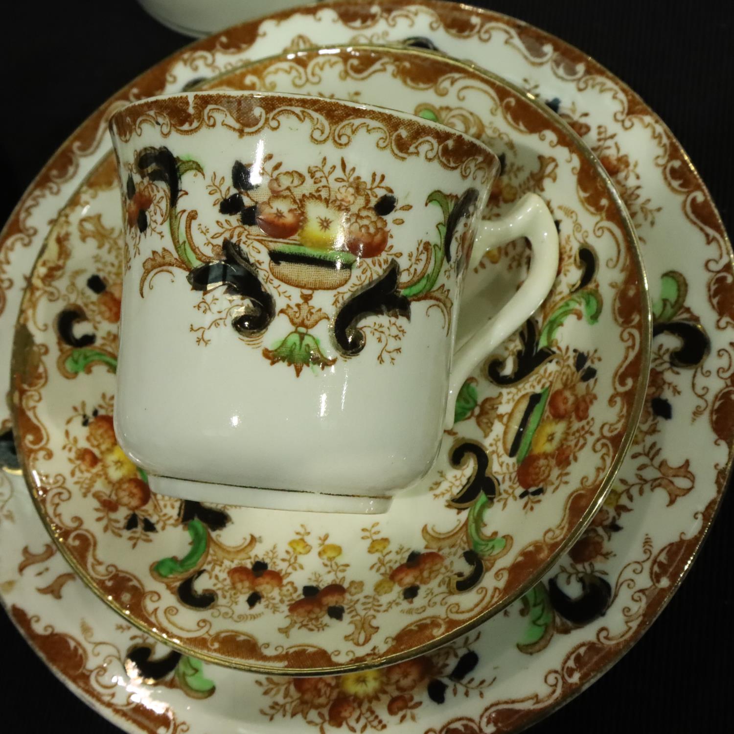 Edwardian tea service of thirty pieces with gilt and floral decoration, signs of use and wear - Image 2 of 3