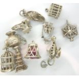 Ten 925 silver charms to include a bird cage and spiders web, combined 30g. P&P Group 1 (£14+VAT for