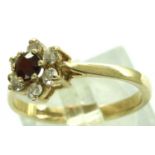 9ct gold ruby and white stone set daisy ring, size O, 2.1g. P&P Group 1 (£14+VAT for the first lot