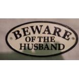 Cast iron Beware of the Husband sign. D: 16 cm. P&P Group 1 (£14+VAT for the first lot and £1+VAT