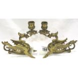 Pair of brass Welsh Dragon candlesticks, each H: 17 cm. Solid and heavy, probably Mid Century. P&P