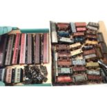 Approximately forty unboxed OO scale wagons, mostly weathered and ten coaches. Mostly for spares and