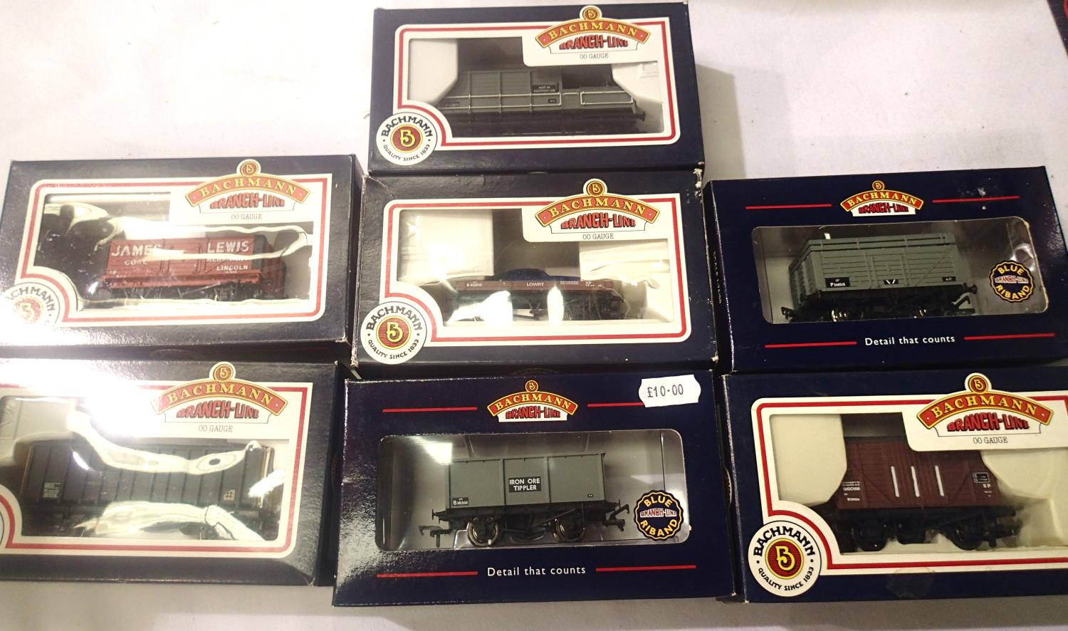Seven Bachmann wagons, various types including flat and capri, tippler, toad brake etc. Mostly