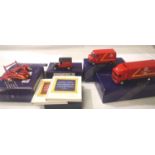 Four Corgi Royal Mail millennium collection vehicles, and two books. P&P Group 1 (£14+VAT for the