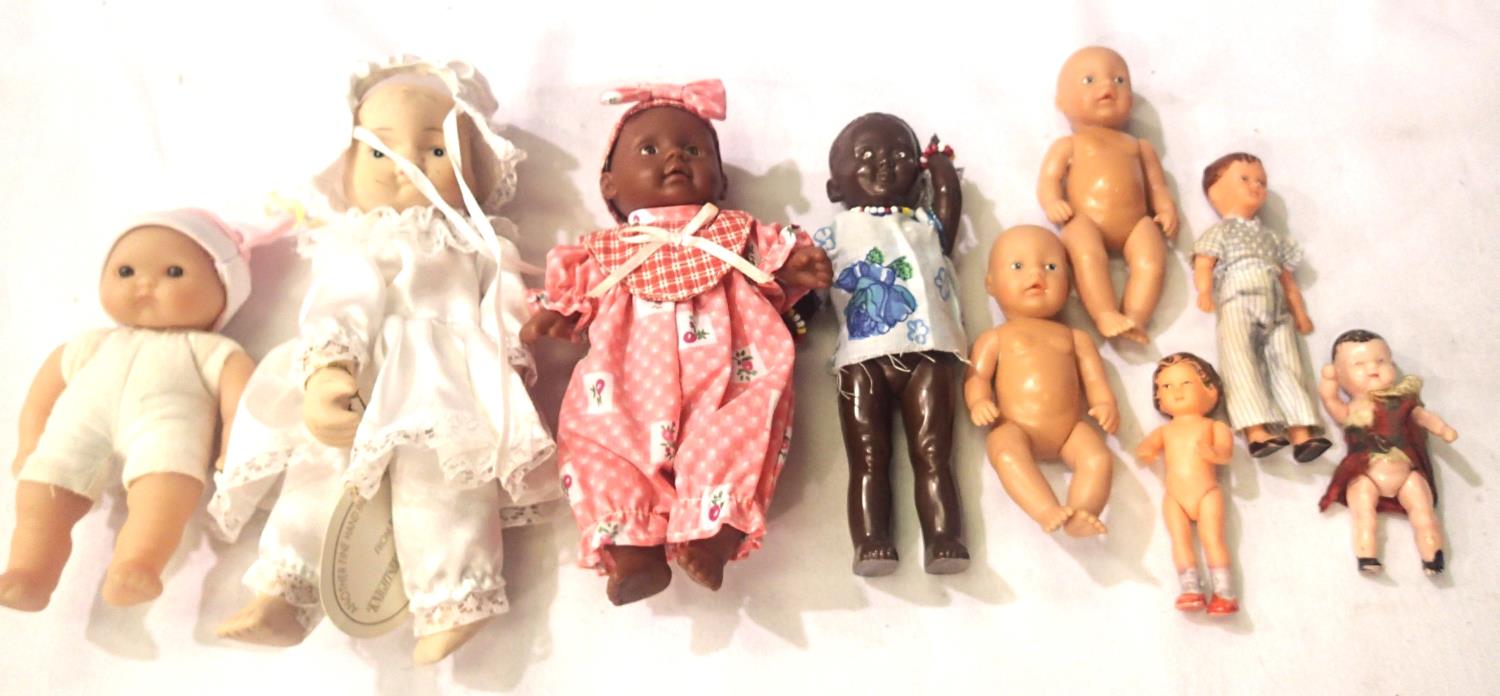 Nine vintage small dolls, tallest H: 20 cm. P&P Group 1 (£14+VAT for the first lot and £1+VAT for