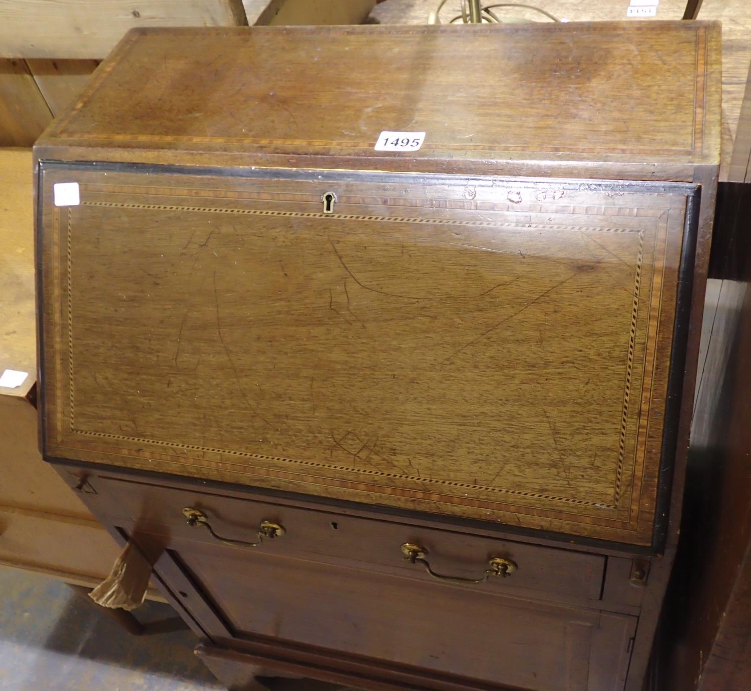 Edwardian inlaid oak bureau with fitted interior, one long drawer over a single door cupboard, 60
