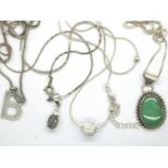 Four 925 silver necklaces with pendants, combined 26g. P&P Group 1 (£14+VAT for the first lot and £
