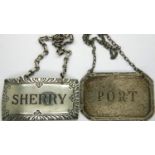 Two wine bottle labels, one sterling silver, one plated. P&P Group 1 (£14+VAT for the first lot