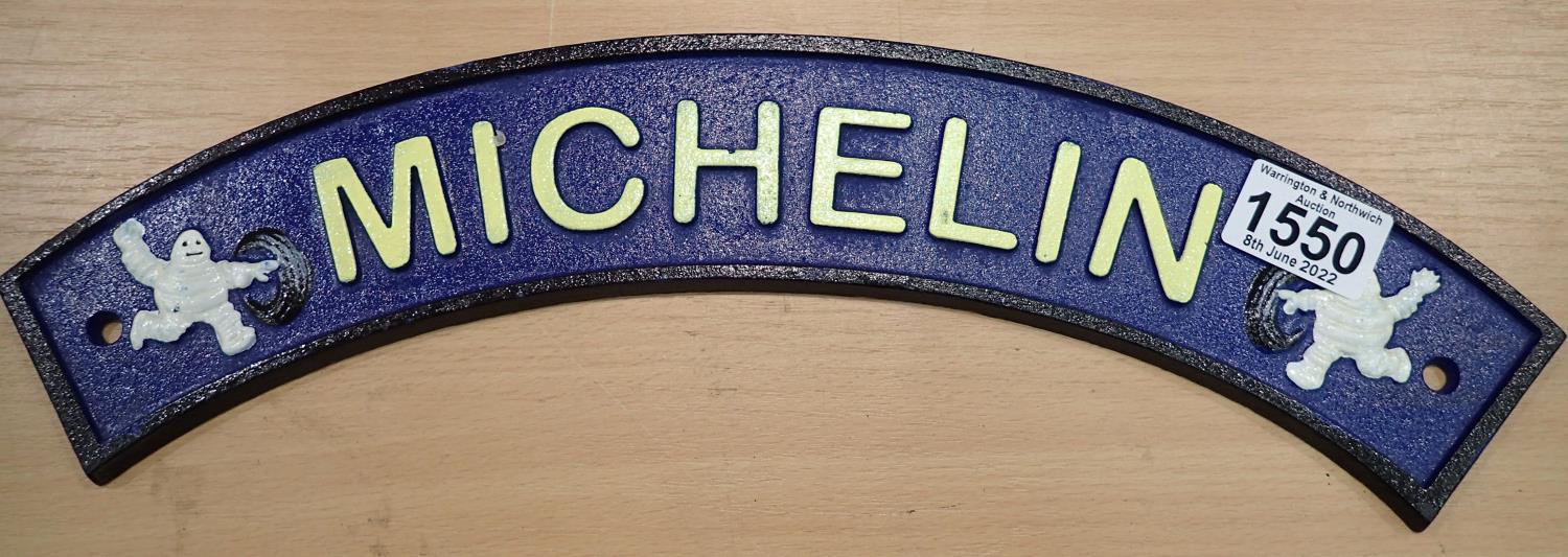 Cast iron Michelin Man curved sign, 40 x 7 cm. P&P Group 2 (£18+VAT for the first lot and £3+VAT for