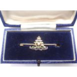 9ct gold Royal Artillery sweetheart brooch with enamelled badge, Kings Crown, 4.2g. P&P Group 1 (£