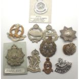 Ten WWI and later British cap badges, six damaged. P&P Group 1 (£14+VAT for the first lot and £1+VAT