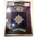 Irish Guards presentation, comprising brass cap badge, wired bullion and a pair of shoulder