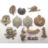 Twelve WWI and later British cap and shoulder badges. P&P Group 1 (£14+VAT for the first lot and £