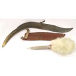 Two vintage hunting knives, one large folding with antler grip, the other Swedish with fur covered