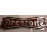 A firestone painted cast iron motoring sign. P&P Group 2 (£18+VAT for the first lot and £3+VAT for