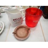 Bells whisky water jug, a Remy red ice bucket and a copper ashtray. Not available for in-house P&