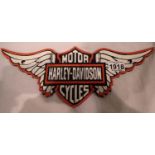 Large cast iron Harley Davidson winged plaque, L: 30 cm. P&P Group 2 (£18+VAT for the first lot