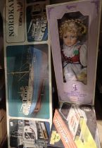 Regency porcelain boxed doll, a Nordkap billing boat and a Reel 45 remote control car. Not available